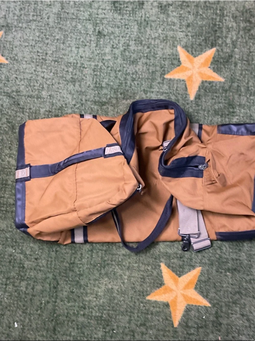NRA SYMBOL Tan Canvas Duffel Bag with Navy Black Trim and Shoulder Strap